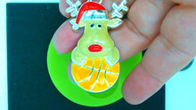 Load image into Gallery viewer, Silicone Mold Christmas Reindeer with Santa Hat and antlers holding a basketball pin jewelry wax, gypsum, resin, hot glue, soap, clay, metal